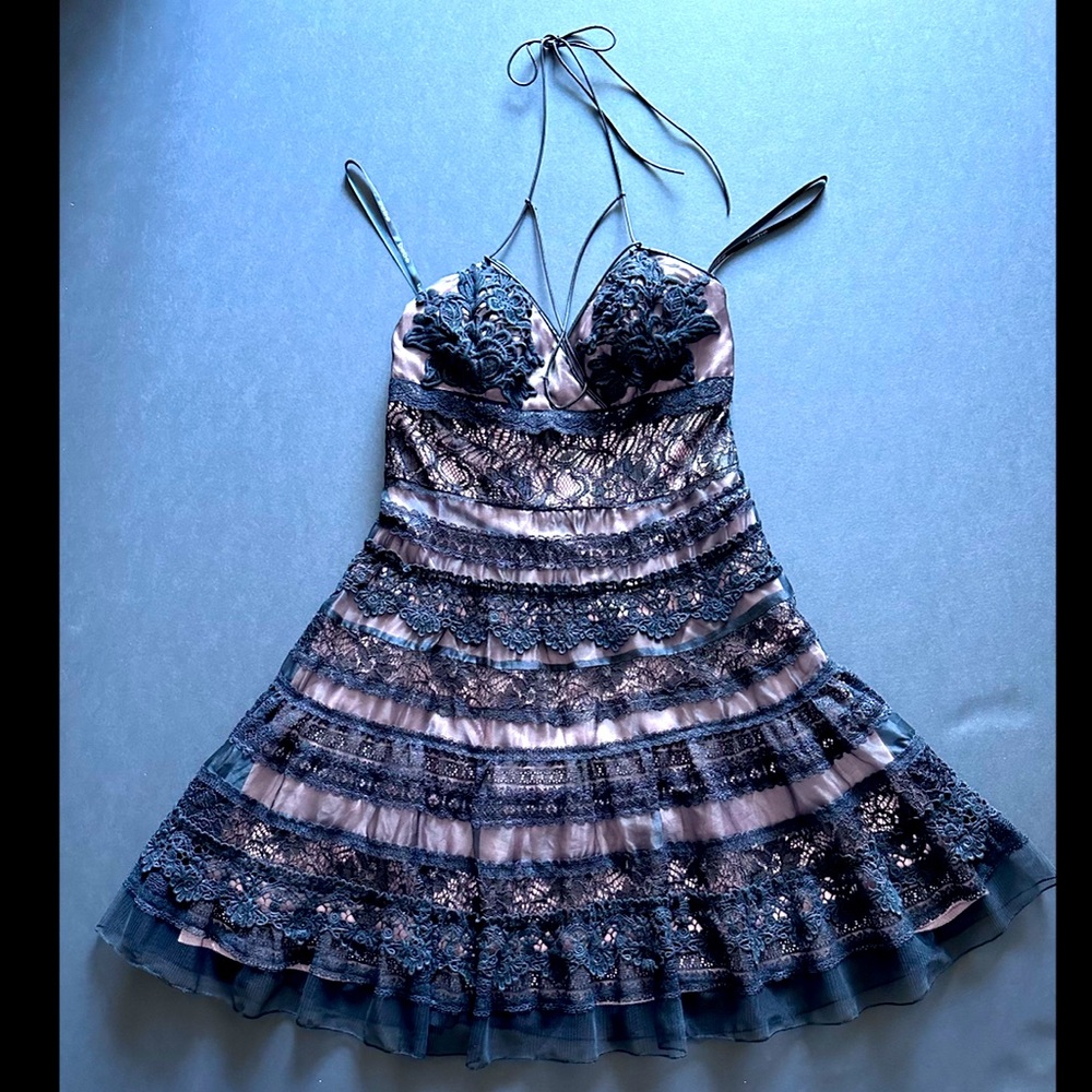 Elegant crochet dress with leather straps, stunning and feminine.